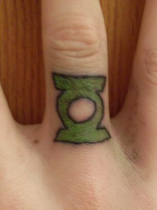 Symbol Tattoo On Finger